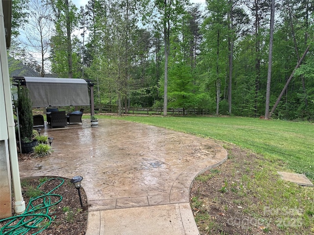 view of patio featuring fence