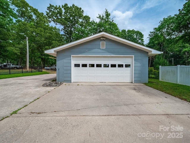 detached garage with fence