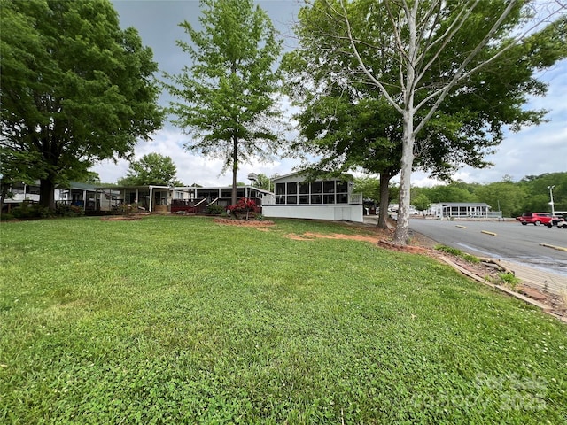 view of yard with a sunroom