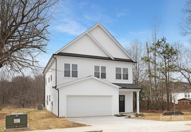 view of front facade with board and batten siding, a shingled roof, central air condition unit, a garage, and concrete driveway