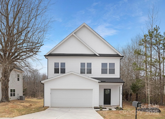 traditional home with a garage, board and batten siding, concrete driveway, and roof with shingles