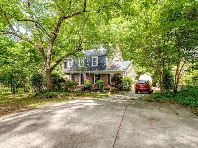 view of front of home with brick siding