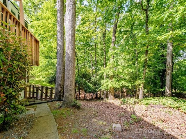 view of yard with a wooded view
