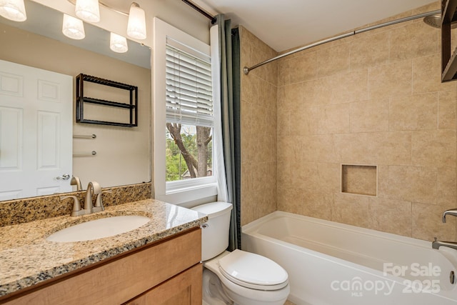 full bath with toilet, washtub / shower combination, and vanity