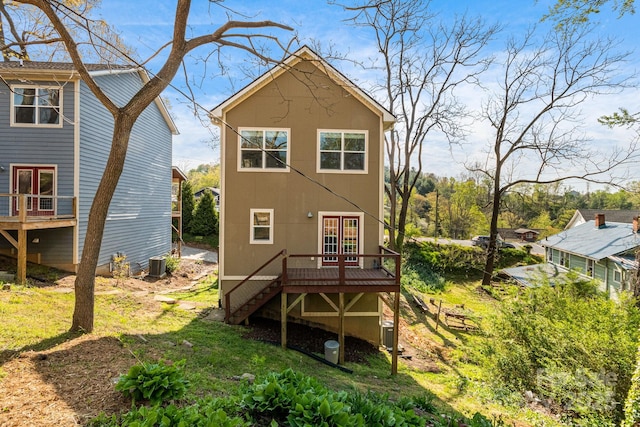 back of house with a lawn, central AC, a deck, and stairway