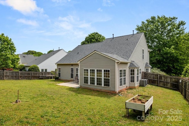 back of property featuring central AC unit, a patio area, a yard, and a fenced backyard