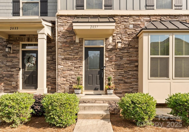 view of exterior entry featuring stone siding