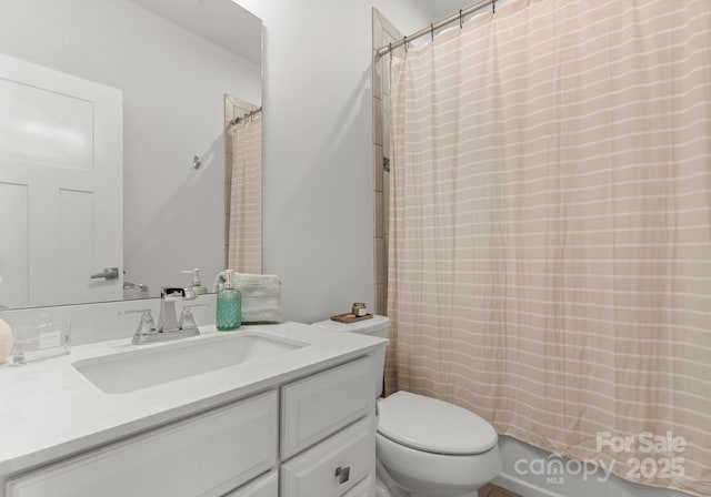 full bath with vanity and toilet