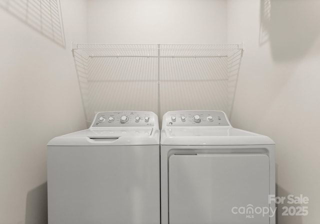 clothes washing area with laundry area and independent washer and dryer