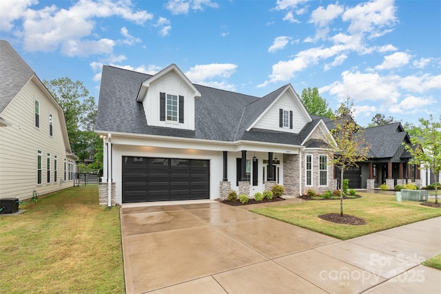 14119 Shelburne Village Dr, Charlotte, NC 28278 - view of front of home with a front lawn, stone siding, concrete driveway, and roof with shingles