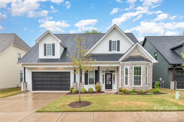 14119 Shelburne Village Dr, Charlotte, NC 28278 - view of front of home featuring a garage, a front lawn, concrete driveway, and stone siding