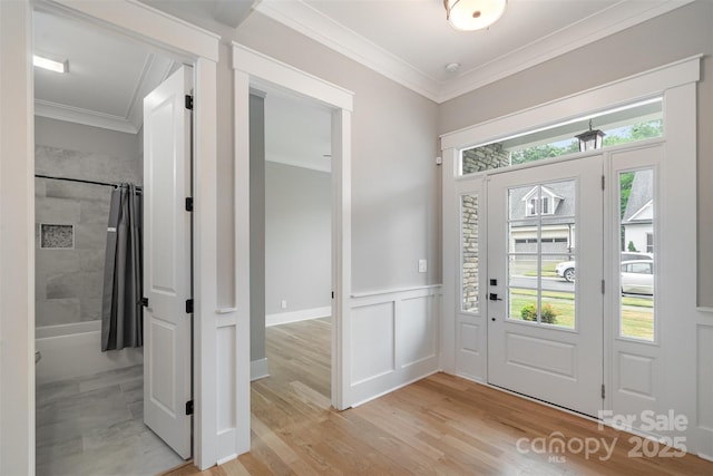 14119 Shelburne Village Dr, Charlotte, NC 28278 - foyer entrance with ornamental molding, light wood finished floors, and wainscoting