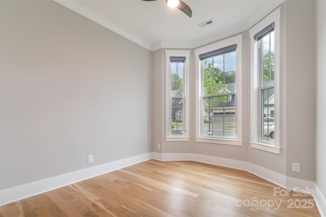 14119 Shelburne Village Dr, Charlotte, NC 28278 - unfurnished room featuring ceiling fan, light wood-type flooring, crown molding, visible vents, and baseboards