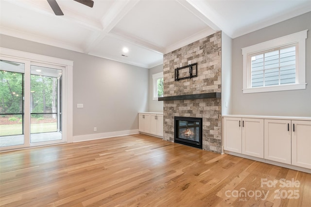 14119 Shelburne Village Dr, Charlotte, NC 28278 - unfurnished living room with beamed ceiling, a large fireplace, light wood-style floors, ceiling fan, and baseboards