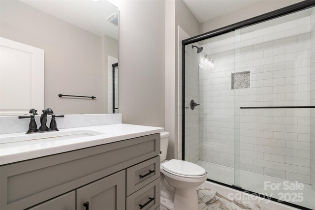 14119 Shelburne Village Dr, Charlotte, NC 28278 - bathroom featuring a stall shower, toilet, and vanity