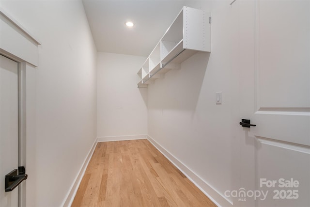 14119 Shelburne Village Dr, Charlotte, NC 28278 - spacious closet featuring light wood finished floors