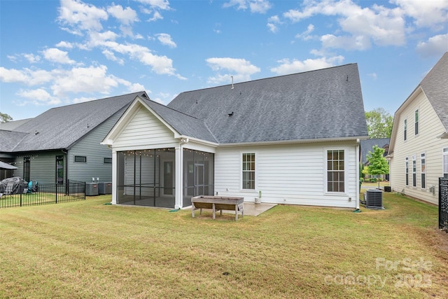 14119 Shelburne Village Dr, Charlotte, NC 28278 - rear view of property featuring a sunroom, a yard, and central AC