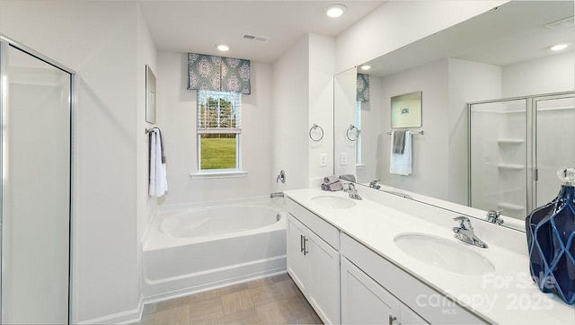 full bath featuring visible vents, a sink, a bath, and a stall shower