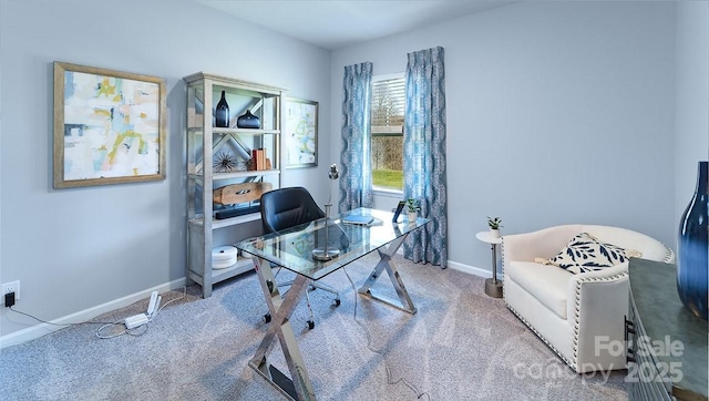 carpeted home office with baseboards