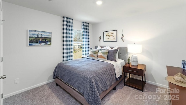 carpeted bedroom with baseboards
