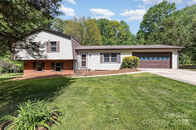 tri-level home featuring brick siding, a front lawn, concrete driveway, and an attached garage