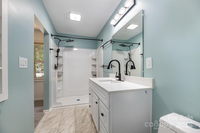 bathroom with walk in shower, marble finish floor, toilet, vanity, and baseboards