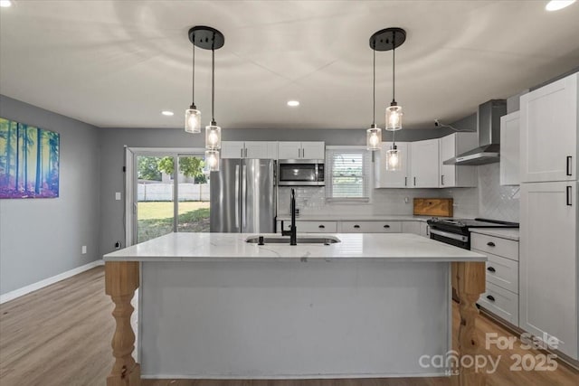 135 Mcshag Dr, Kannapolis, NC 28081 - kitchen with wall chimney range hood, appliances with stainless steel finishes, a sink, baseboards, and decorative backsplash