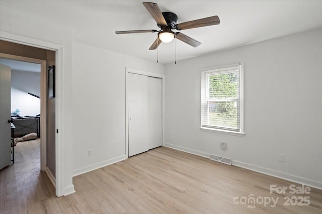 135 Mcshag Dr, Kannapolis, NC 28081 - unfurnished bedroom featuring baseboards, light wood-style flooring, and visible vents