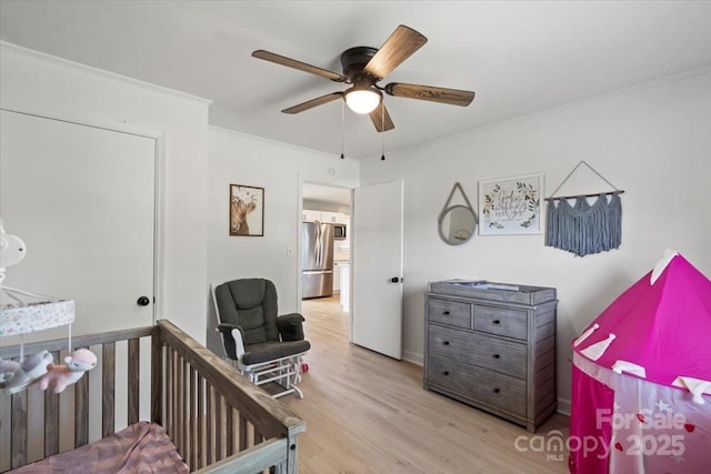135 Mcshag Dr, Kannapolis, NC 28081 - bedroom with crown molding, ceiling fan, freestanding refrigerator, and wood finished floors