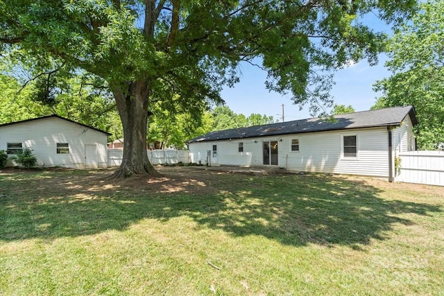 135 Mcshag Dr, Kannapolis, NC 28081 - back of house featuring fence and a lawn