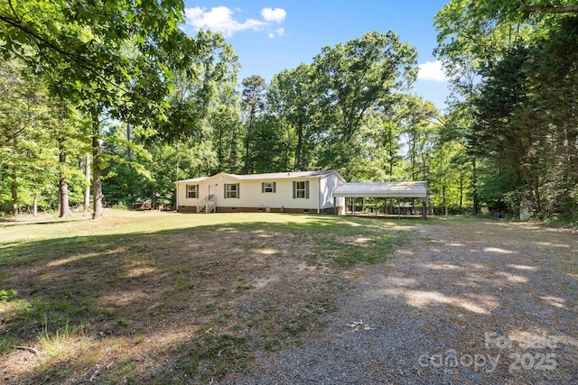 3317 Treyburn Dr, Midland, NC 28107 - manufactured / mobile home featuring a detached carport, driveway, and crawl space