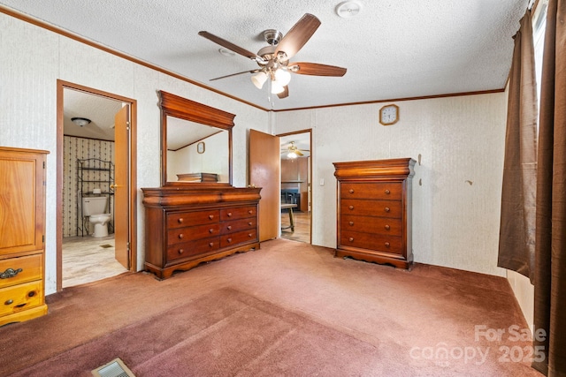 3317 Treyburn Dr, Midland, NC 28107 - carpeted bedroom featuring crown molding, visible vents, ensuite bathroom, a textured ceiling, and a ceiling fan