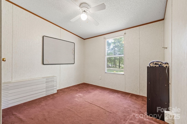 3317 Treyburn Dr, Midland, NC 28107 - unfurnished room with carpet floors, a textured ceiling, a ceiling fan, vaulted ceiling, and ornamental molding