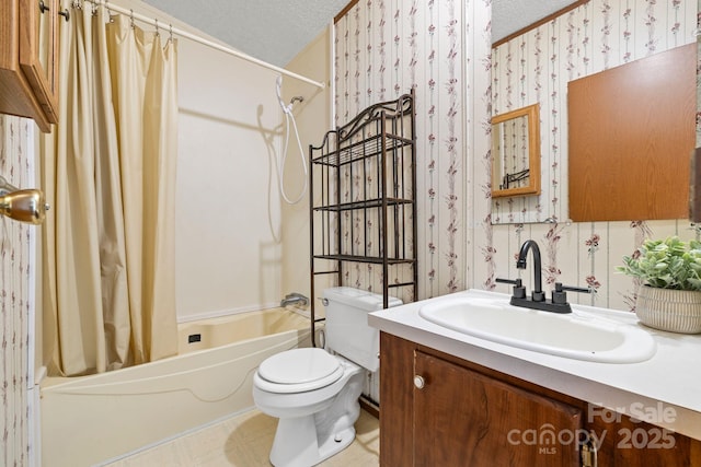 3317 Treyburn Dr, Midland, NC 28107 - full bathroom featuring vanity, toilet, a textured ceiling, wallpapered walls, and shower / tub combo