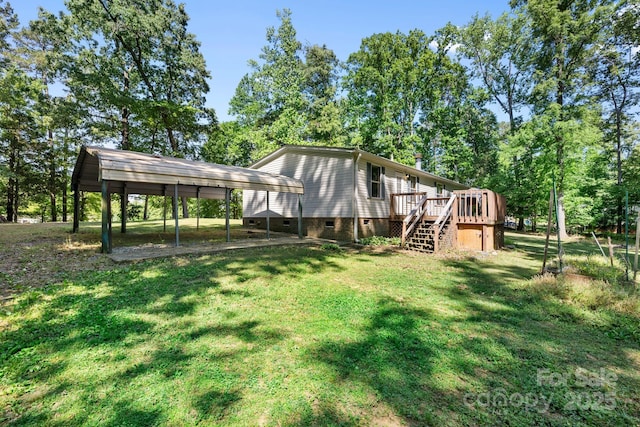 3317 Treyburn Dr, Midland, NC 28107 - back of property featuring a deck, stairs, crawl space, a lawn, and a carport