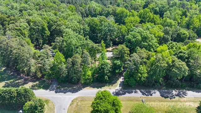 3317 Treyburn Dr, Midland, NC 28107 - aerial view featuring a wooded view