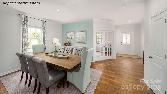 dining space with recessed lighting, baseboards, wood finished floors, and a healthy amount of sunlight