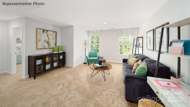 carpeted living room with recessed lighting and baseboards