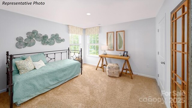 carpeted bedroom with baseboards