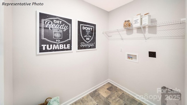 laundry room featuring laundry area, stone finish flooring, electric dryer hookup, hookup for a washing machine, and baseboards