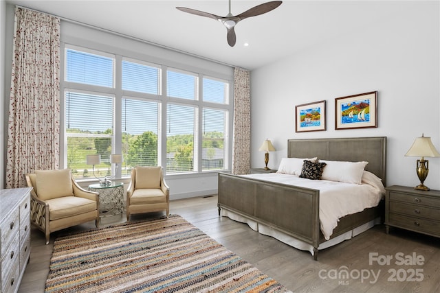 bedroom with recessed lighting, baseboards, ceiling fan, and light wood-type flooring