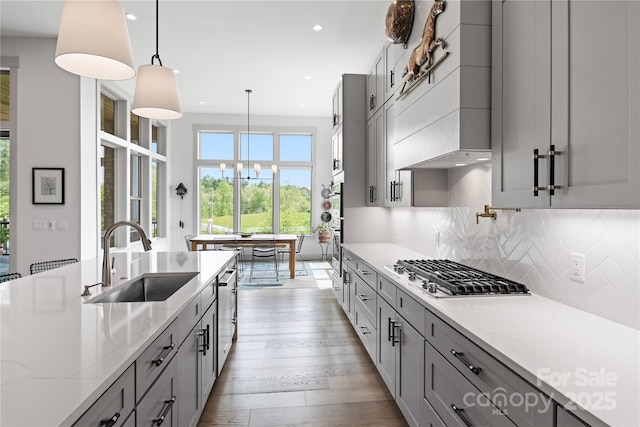 kitchen featuring a sink, gray cabinetry, a chandelier, stainless steel appliances, and recessed lighting