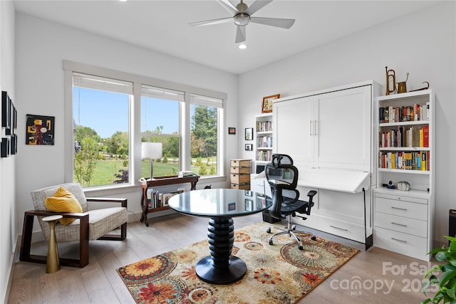 office area featuring recessed lighting, a ceiling fan, and light wood-style floors