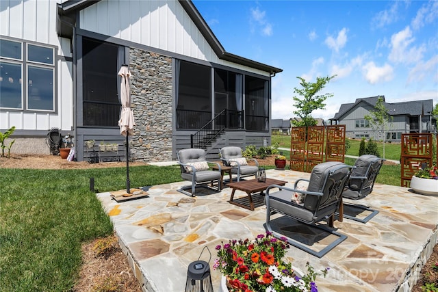 view of patio / terrace featuring a sunroom