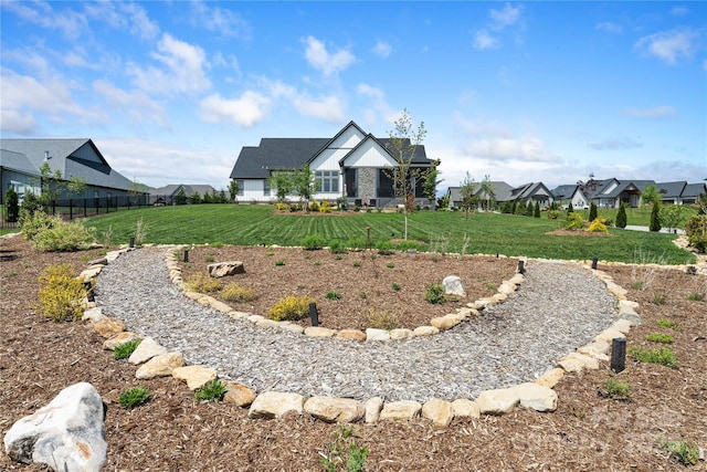view of yard with a residential view and fence