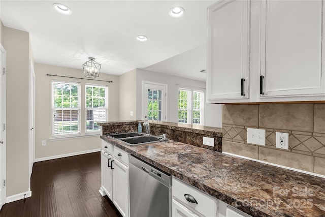kitchen featuring a sink, baseboards, white cabinets, and dishwasher