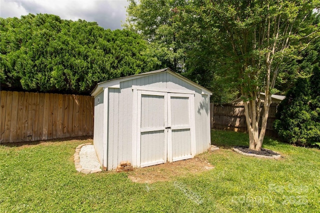 view of shed featuring a fenced backyard