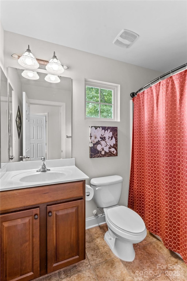 full bathroom featuring toilet, a shower with curtain, vanity, visible vents, and tile patterned floors