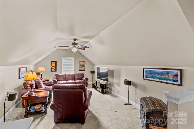 carpeted living area featuring baseboards, lofted ceiling, and ceiling fan