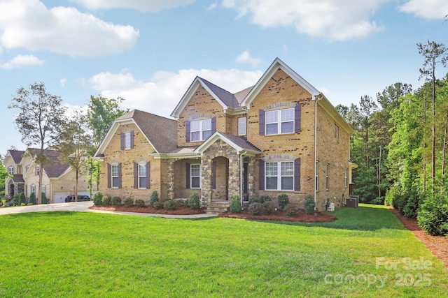 1004 Princesa Dr, Matthews, NC 28104 - view of front of home with brick siding, a front lawn, and central AC